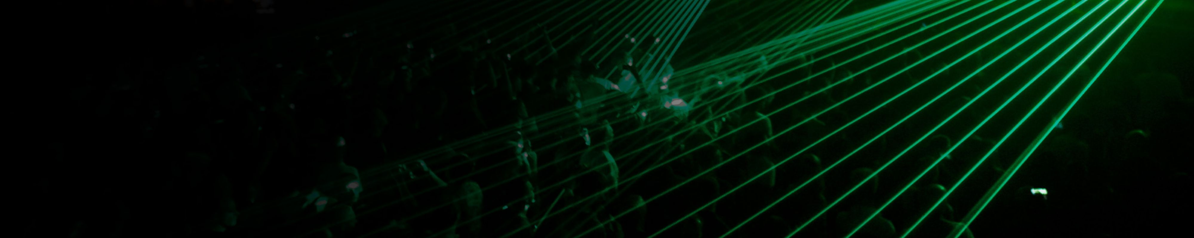 A blurred image in shades of purple, where you can see the shadows of some boys and girls inside what looks like an industrial building.