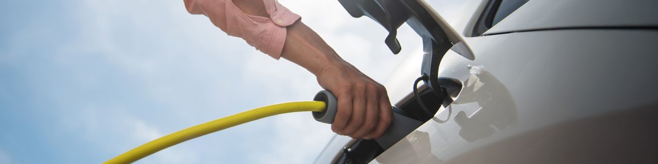 Person charging an electric car