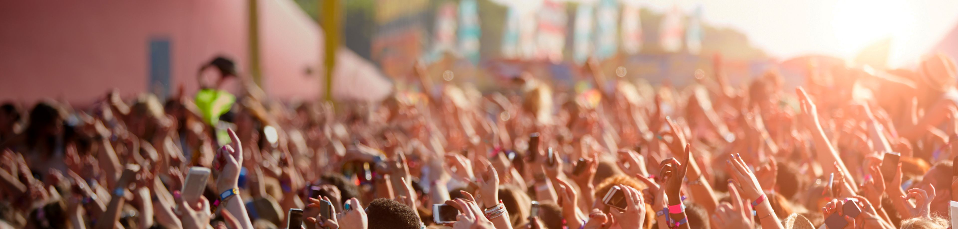 Crowd of people with hands in the air