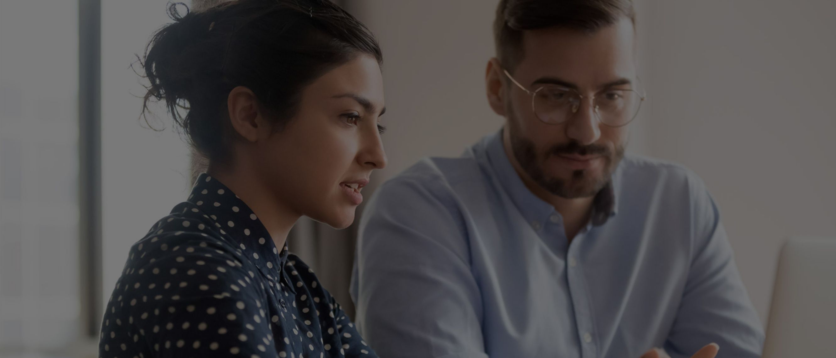 boy and girl looking at a computer
