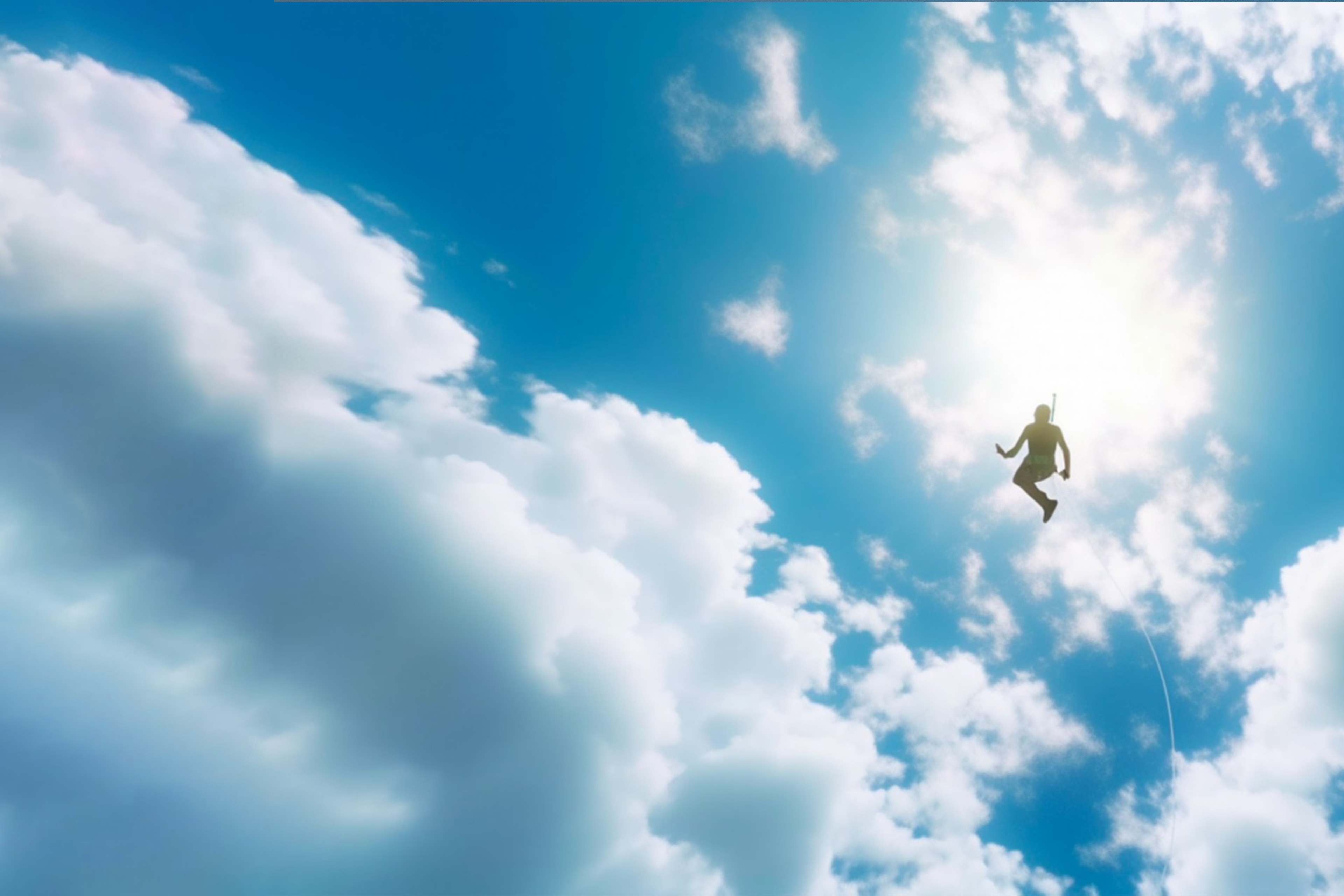 Una persona controluce fluttua in un cielo azzurro, ha una imbracatura che sembra portare ad un paracadute, ma il paracadute non c'è. Al suo posto, ci sono delle nuvole. Nell'immagine compaiono i loghi delle due società.