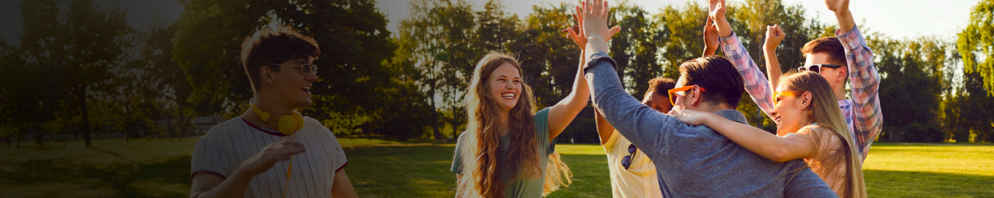 Group of people high-fiving each other