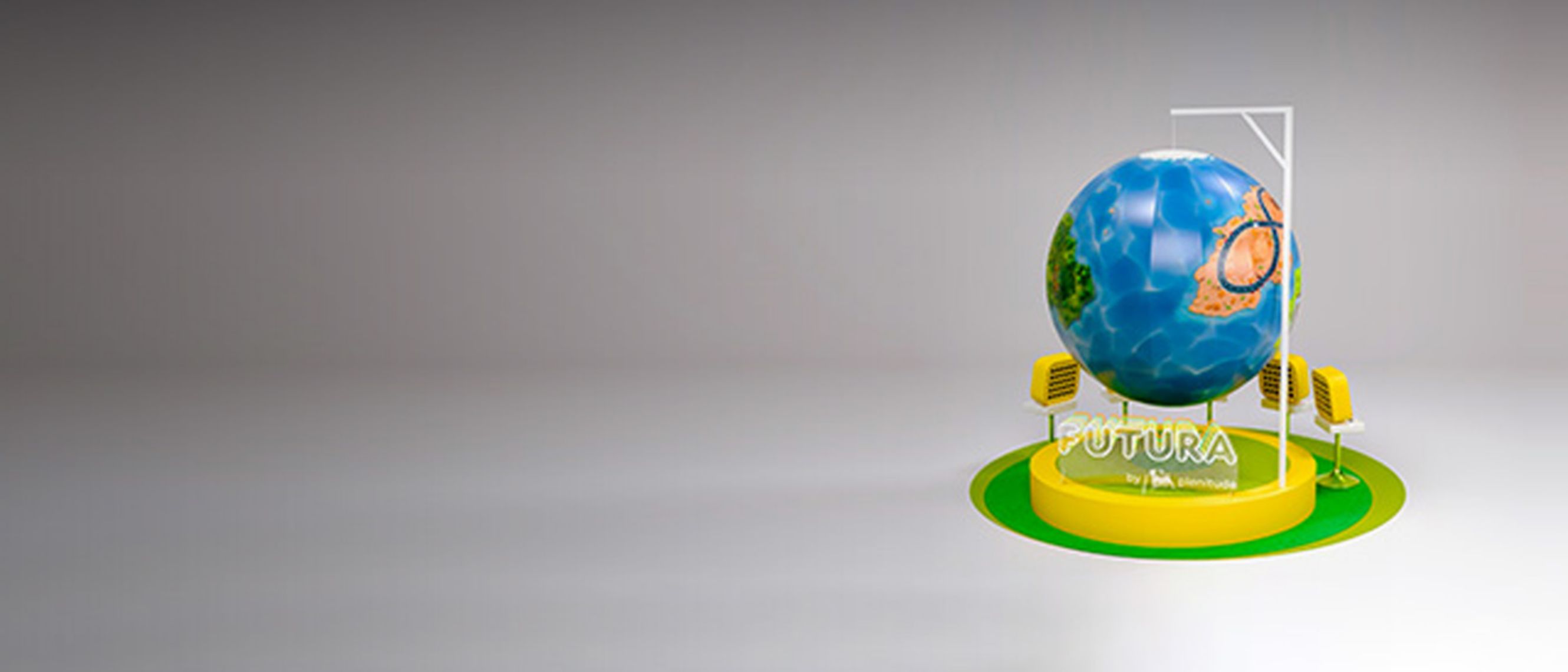 A grey background frames the globe of Futura, Plenitude's new virtual world. One glimpses one of the continents on the globe, which sits on a yellow pedestal with the Plenitude logo in white and the words FUTURA. The pedestal has yellow screens around it, underneath is a kind of green round carpet.