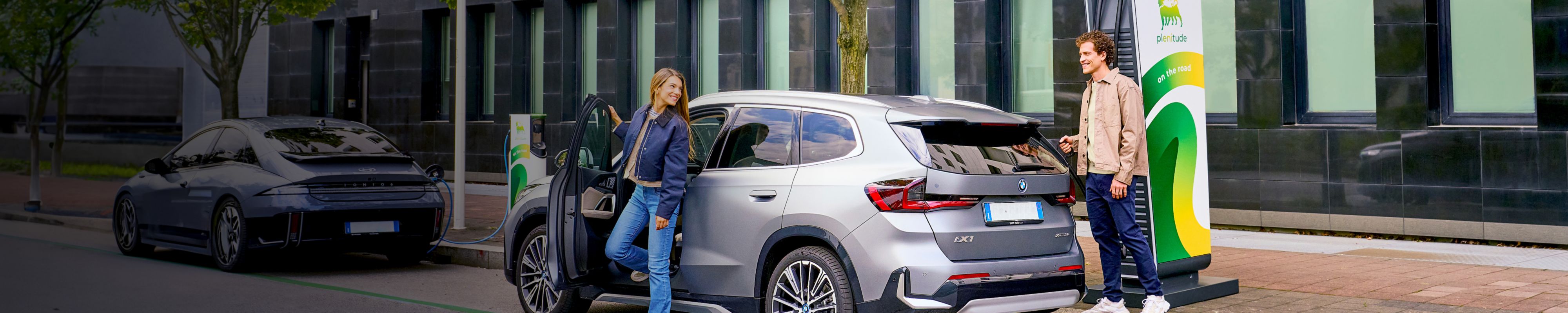 People recharging their car