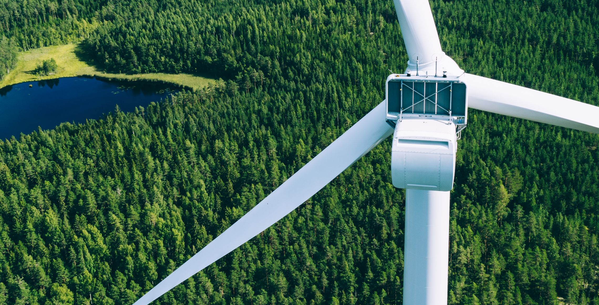 Windmills, wind turbines. Aerial view of windmills in green summer forest in Finland. Wind turbines for electric power with clean and Renewable Energy; Shutterstock ID 2285078097; purchase_order: -; job: -; client: -; other: -